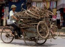 Cyclo_carrying_used_bicycles.jpg